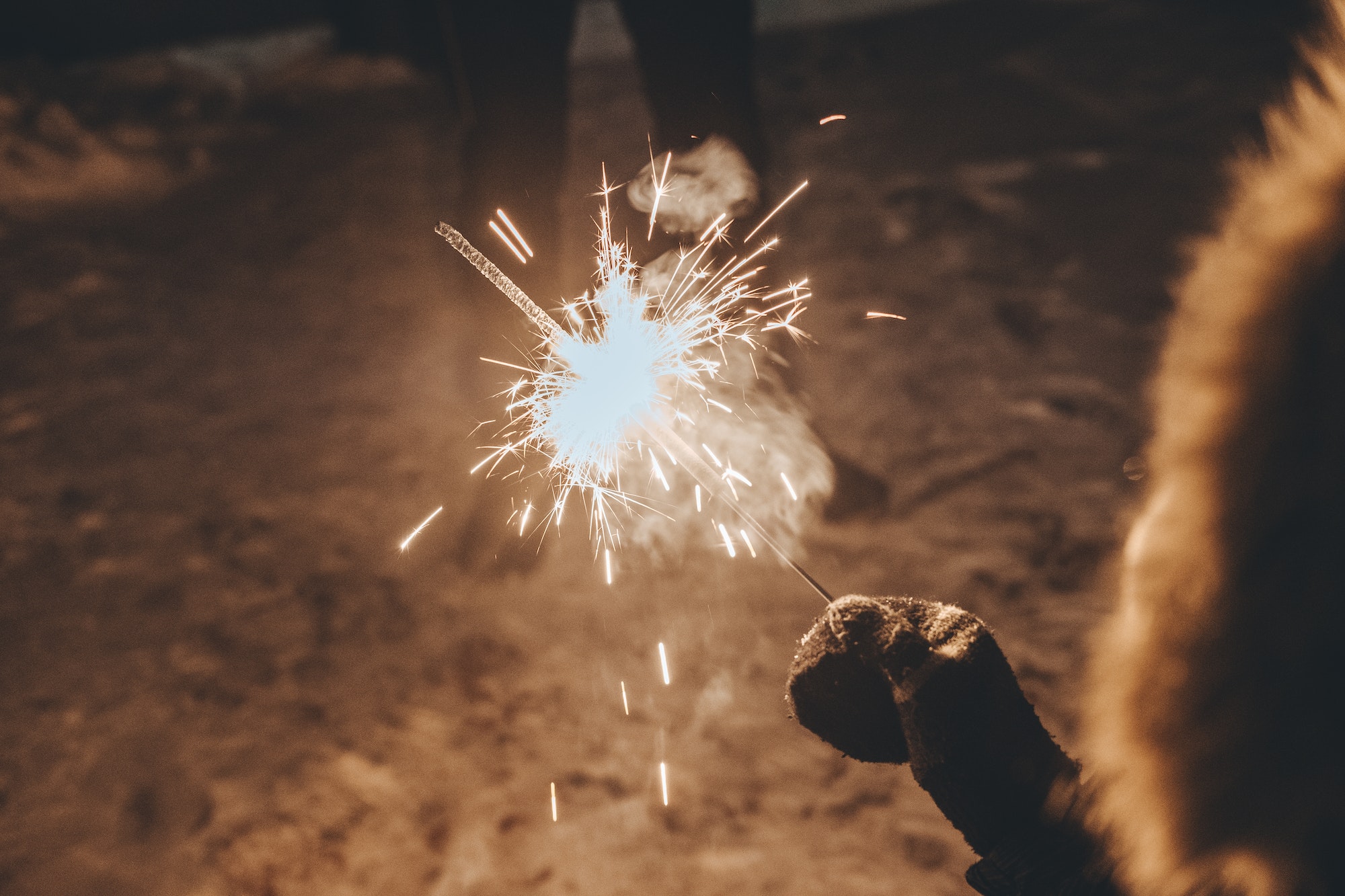 Fireworks in the hands of a child during New Years celebration.